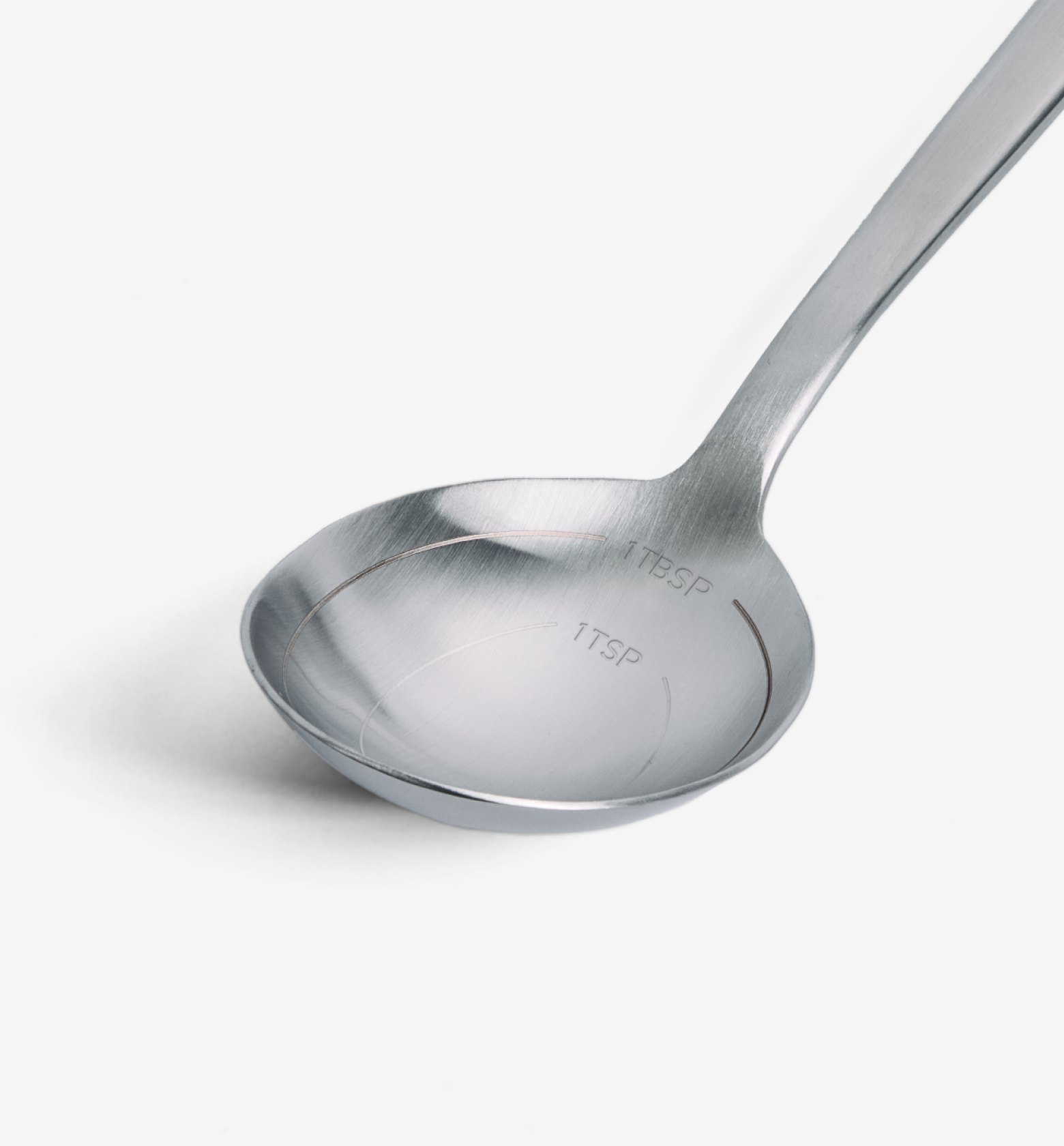 Stainless steel measuring spoon with engraved 1 TBSP and 1 TSP measurement markings
